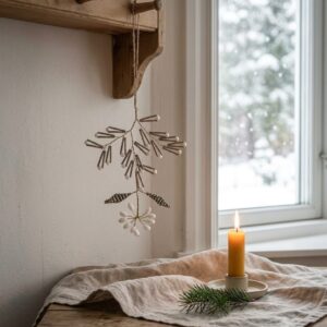 White beaded hanging Christmas sprig with metallic branches and decorative floral accent