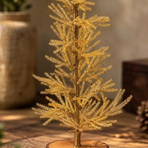 Golden beaded Christmas tree with decorative gold ball accents and rustic wooden base