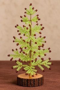 Lime green beaded Christmas tree with brown bead tips, gold-tone stem and rustic wooden base