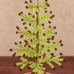 Lime green beaded Christmas tree with brown bead tips, gold-tone stem and rustic wooden base